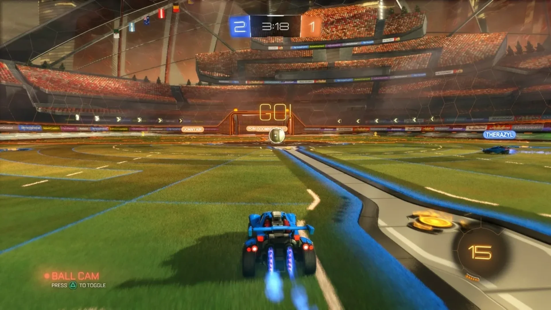 Rocket League car boosts toward the ball during a match inside a large stadium
