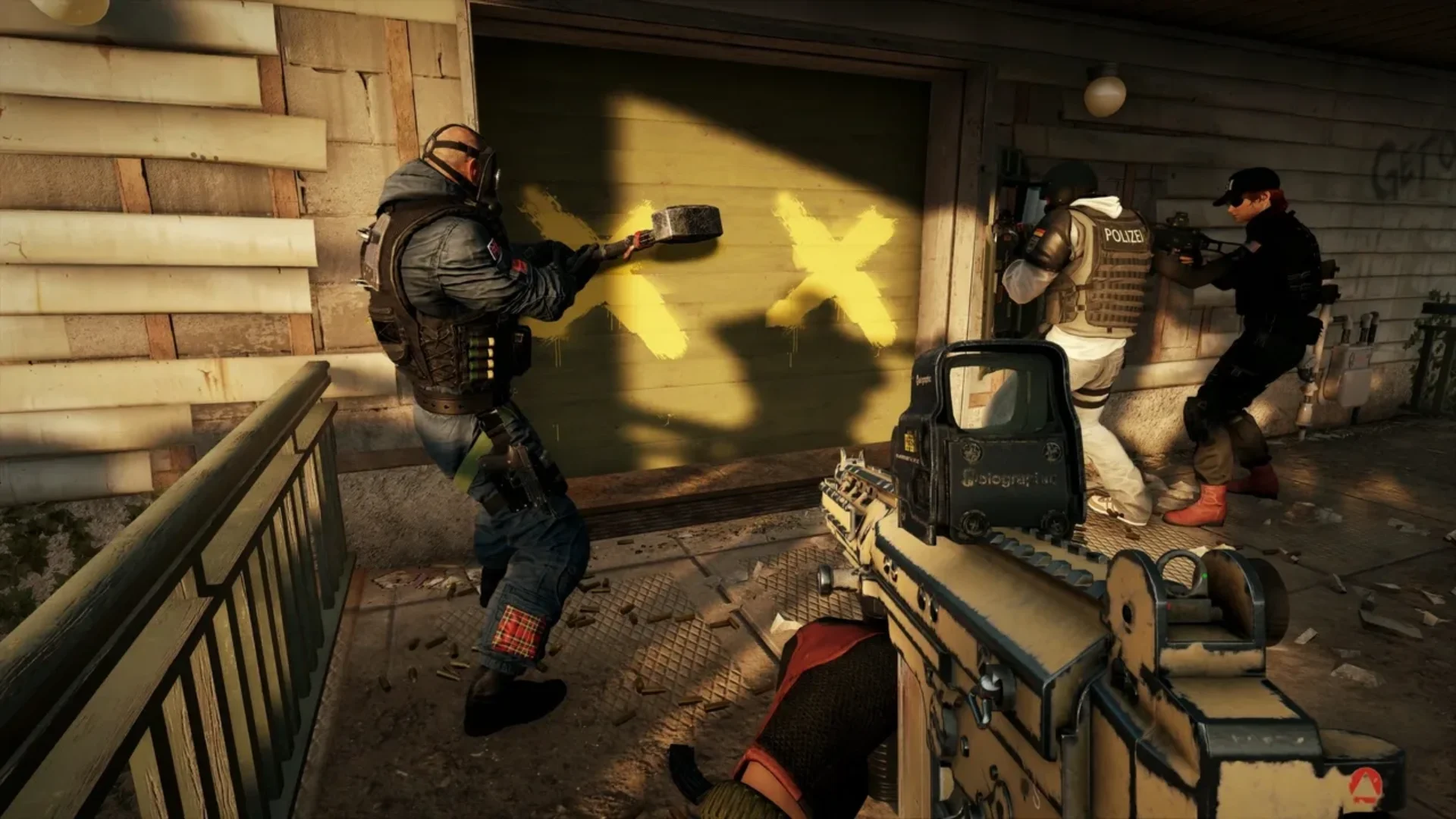 Rainbow Six Siege X operators preparing to breach a barricaded window during a tactical assault