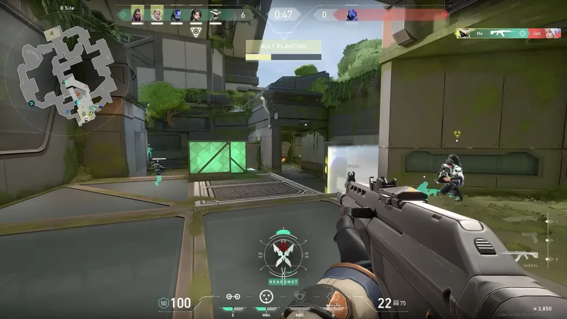 Valorant player aiming a Vandal during a firefight at B Site while an ally plants the Spike
