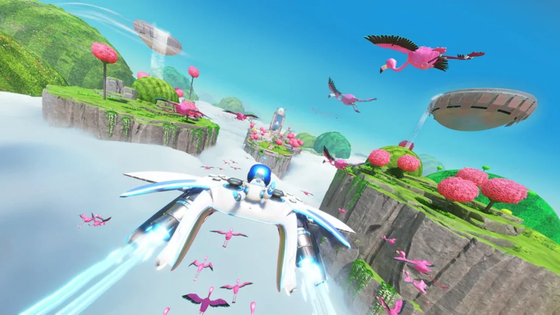 Astro Bot flies through a bright sky level surrounded by pink flamingos and floating green islands
