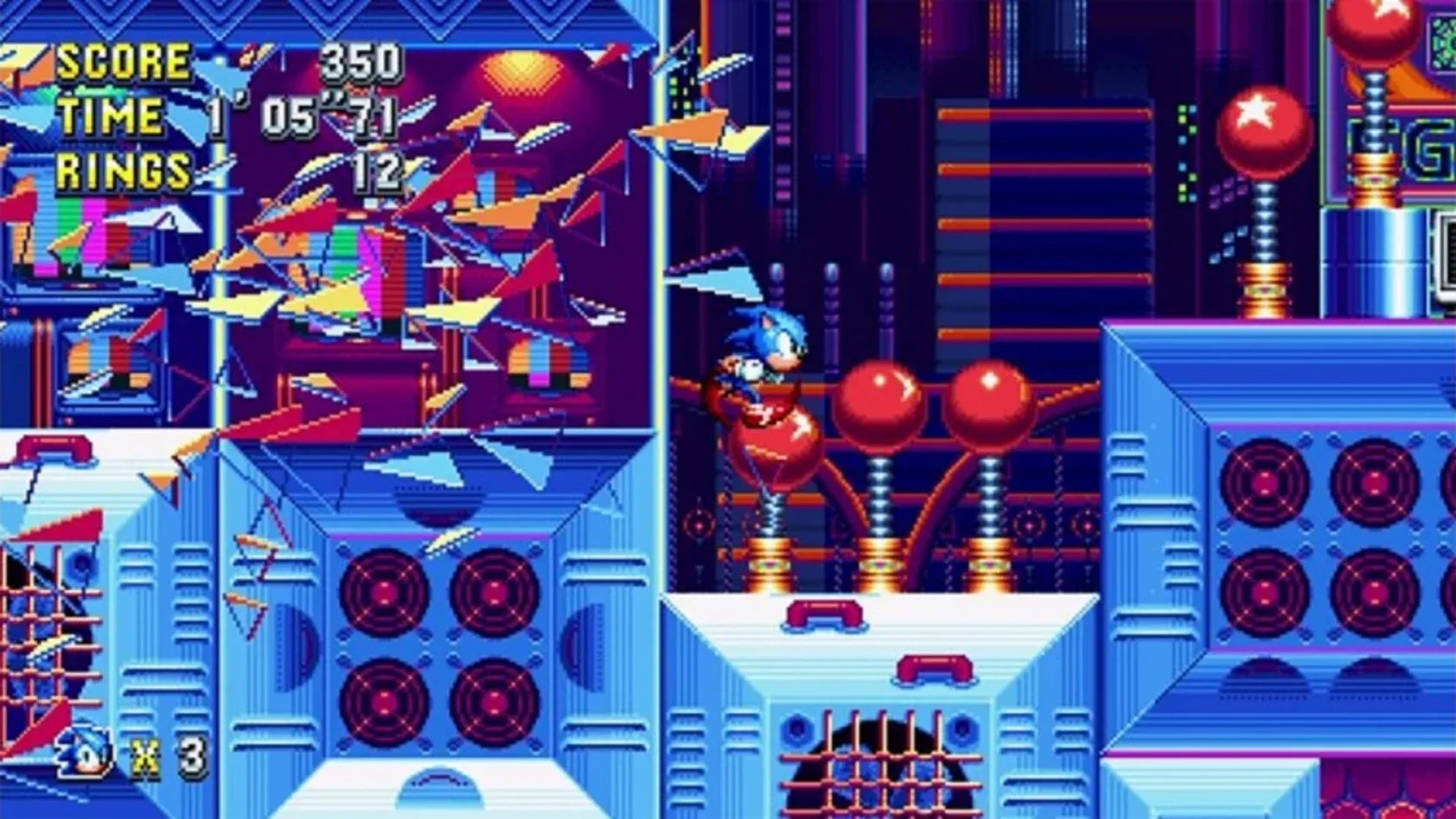 Sonic runs through the colorful Studiopolis Zone filled with bumpers and mechanical obstacles in Sonic Mania