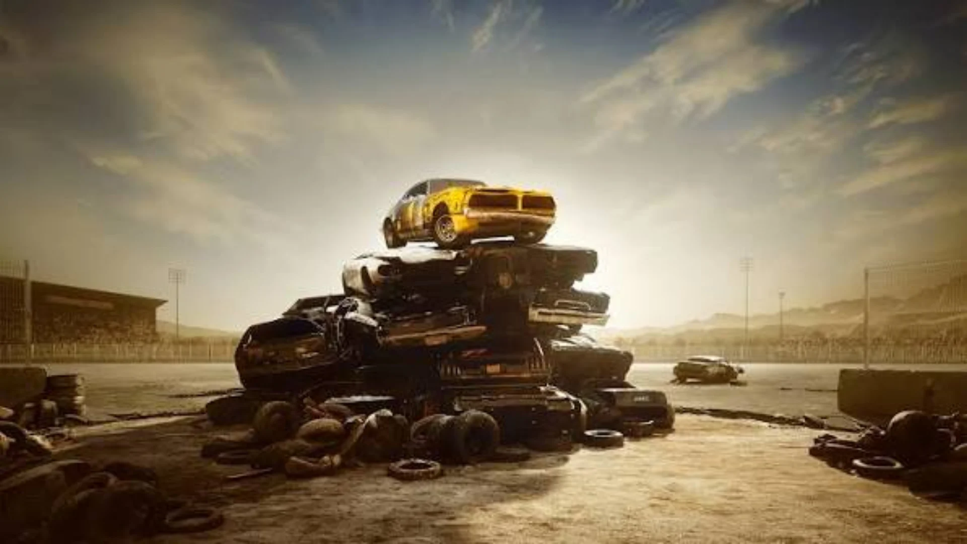 Cars piled on top of each other during a demolition derby in Wreckfest