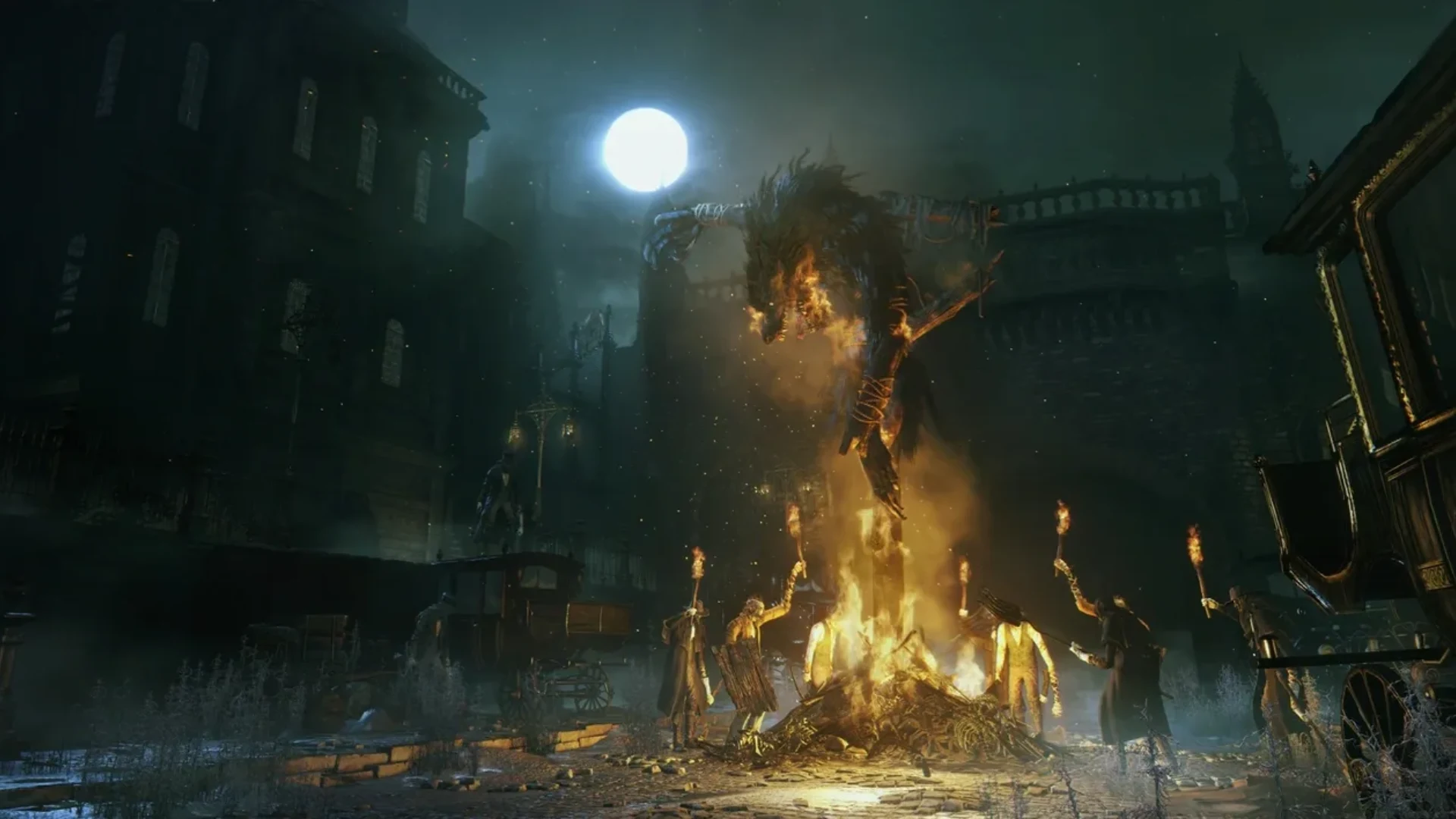 Bloodborne shows a burning creature towering over a bonfire during a dark nighttime scene in the Gothic city of Yharnam.