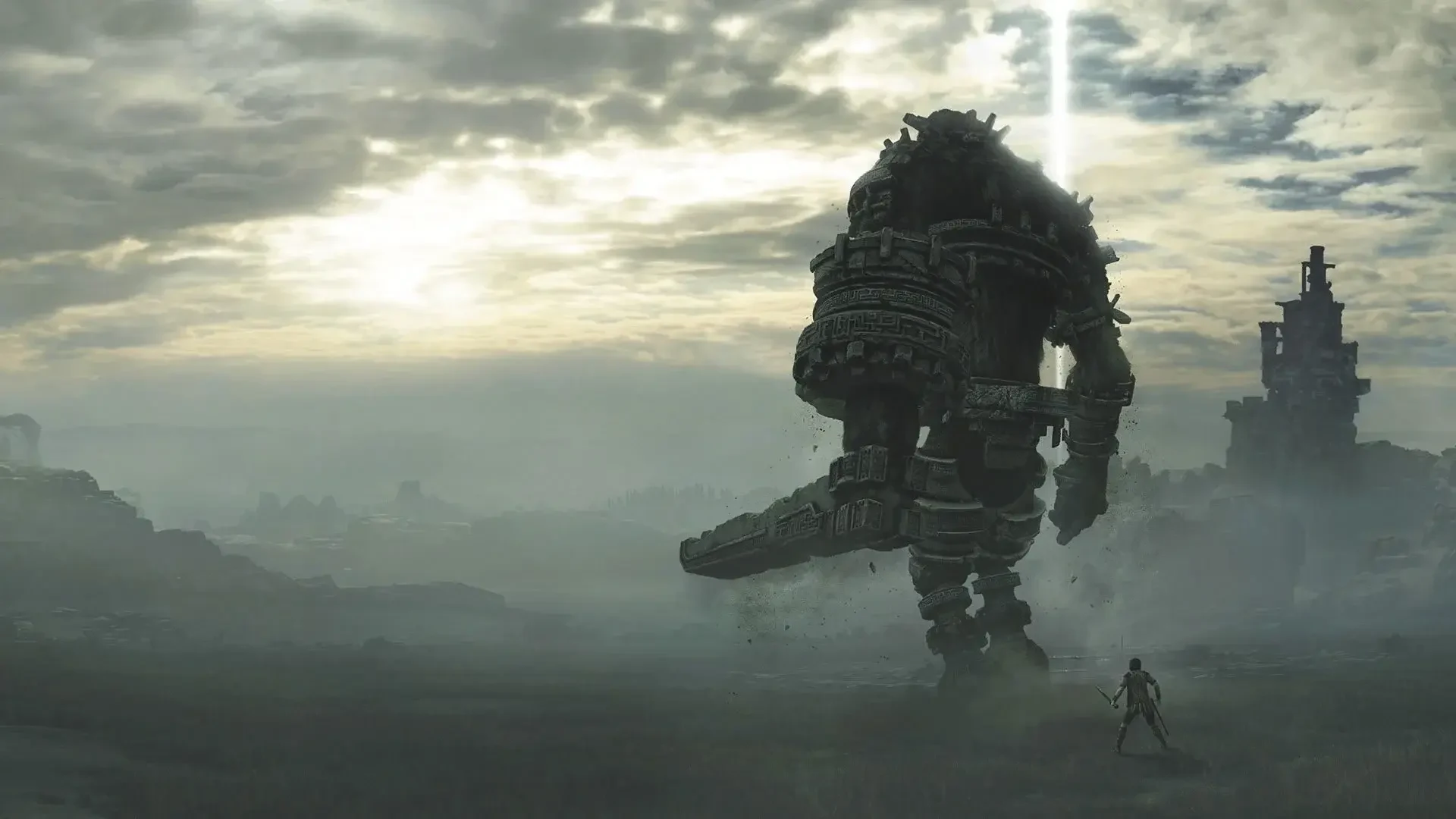 Wander confronts a towering stone colossus across a vast landscape in Shadow of the Colossus.