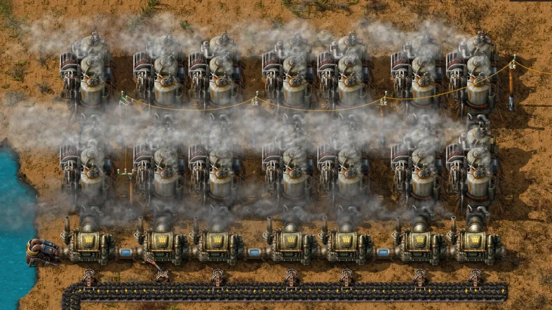 Factorio factory featuring rows of steam engines, boilers, power lines, and conveyor belts.