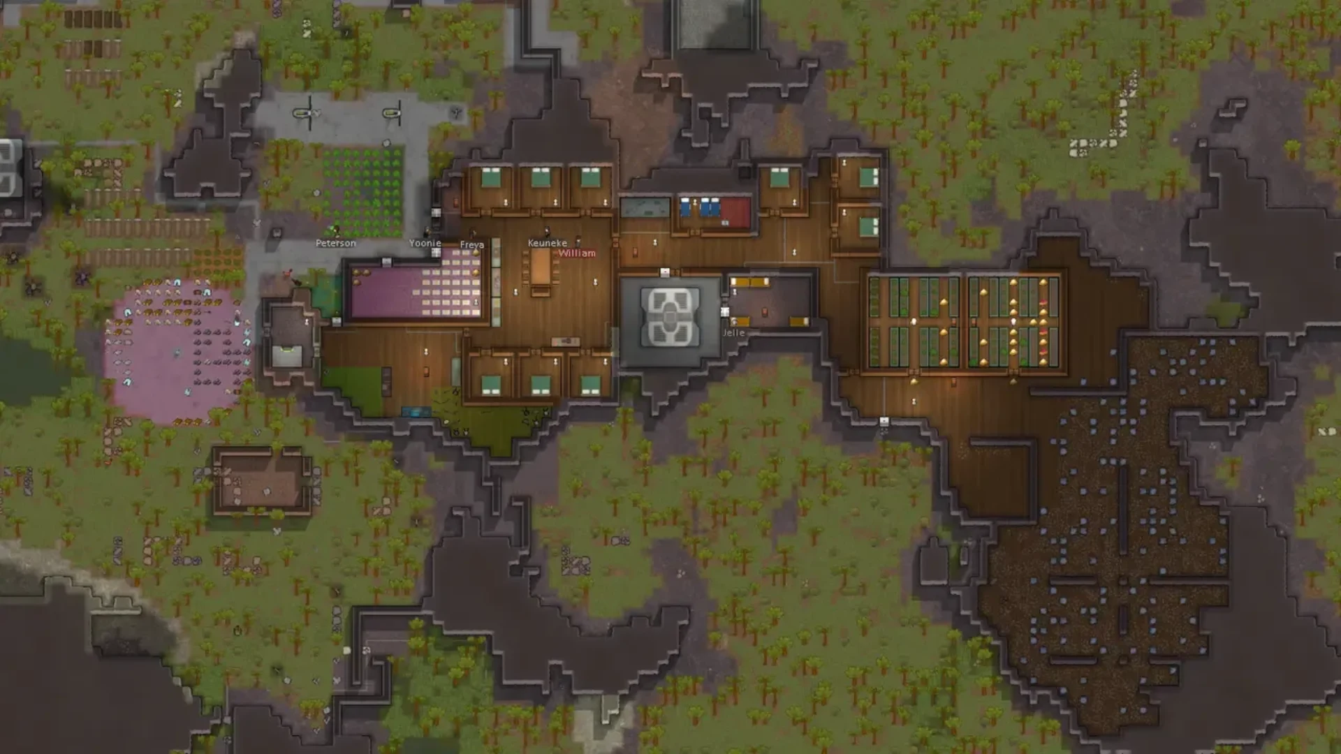 RimWorld colony viewed from above with bedrooms, storage rooms, farms, colonists, and mined rock.