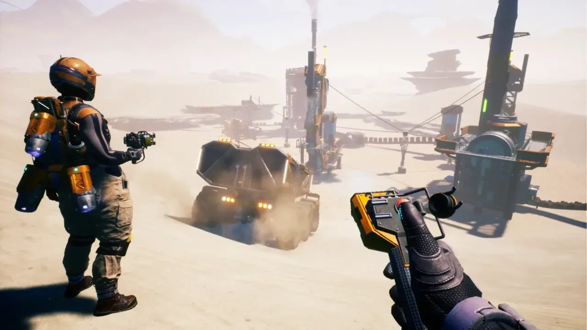 Satisfactory player overlooks a desert industrial complex with another engineer and a large truck.