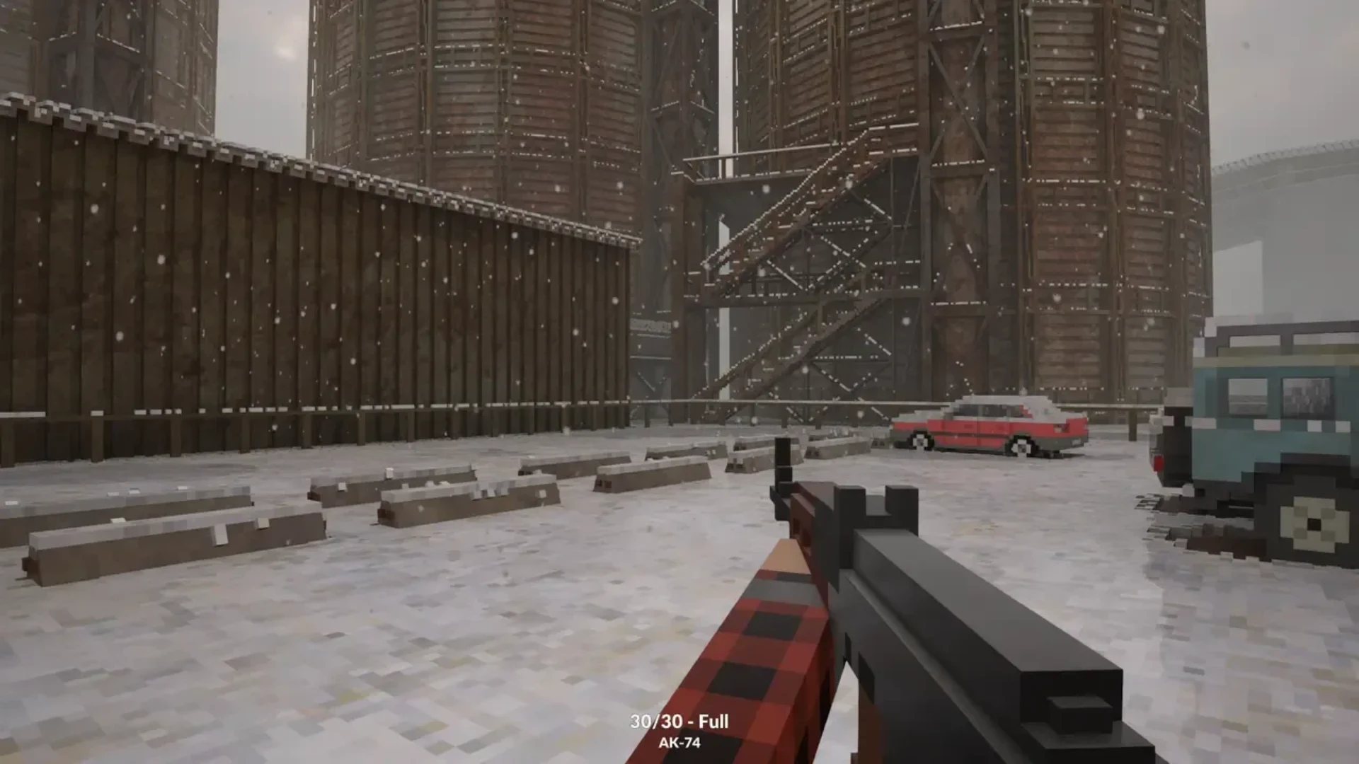 First-person Teardown gameplay shows a firearm aimed across a snowy industrial yard with parked vehicles.