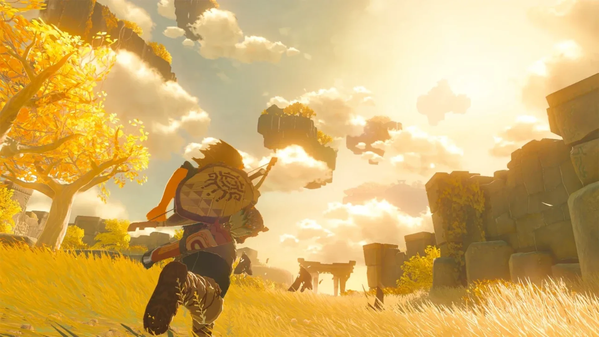 Link runs through a golden landscape beneath floating islands in The Legend of Zelda: Tears of the Kingdom.