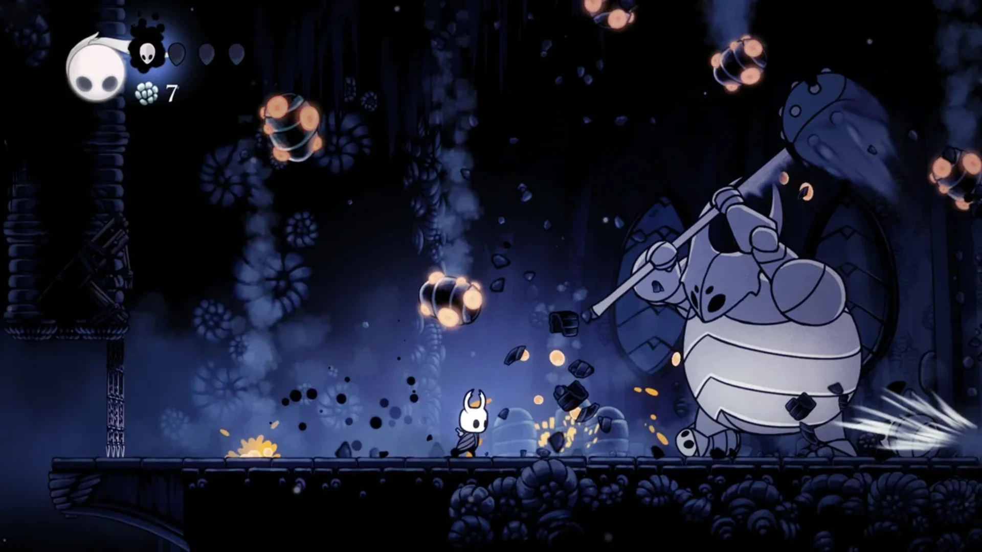 The Knight faces a giant armored boss during a Hollow Knight battle