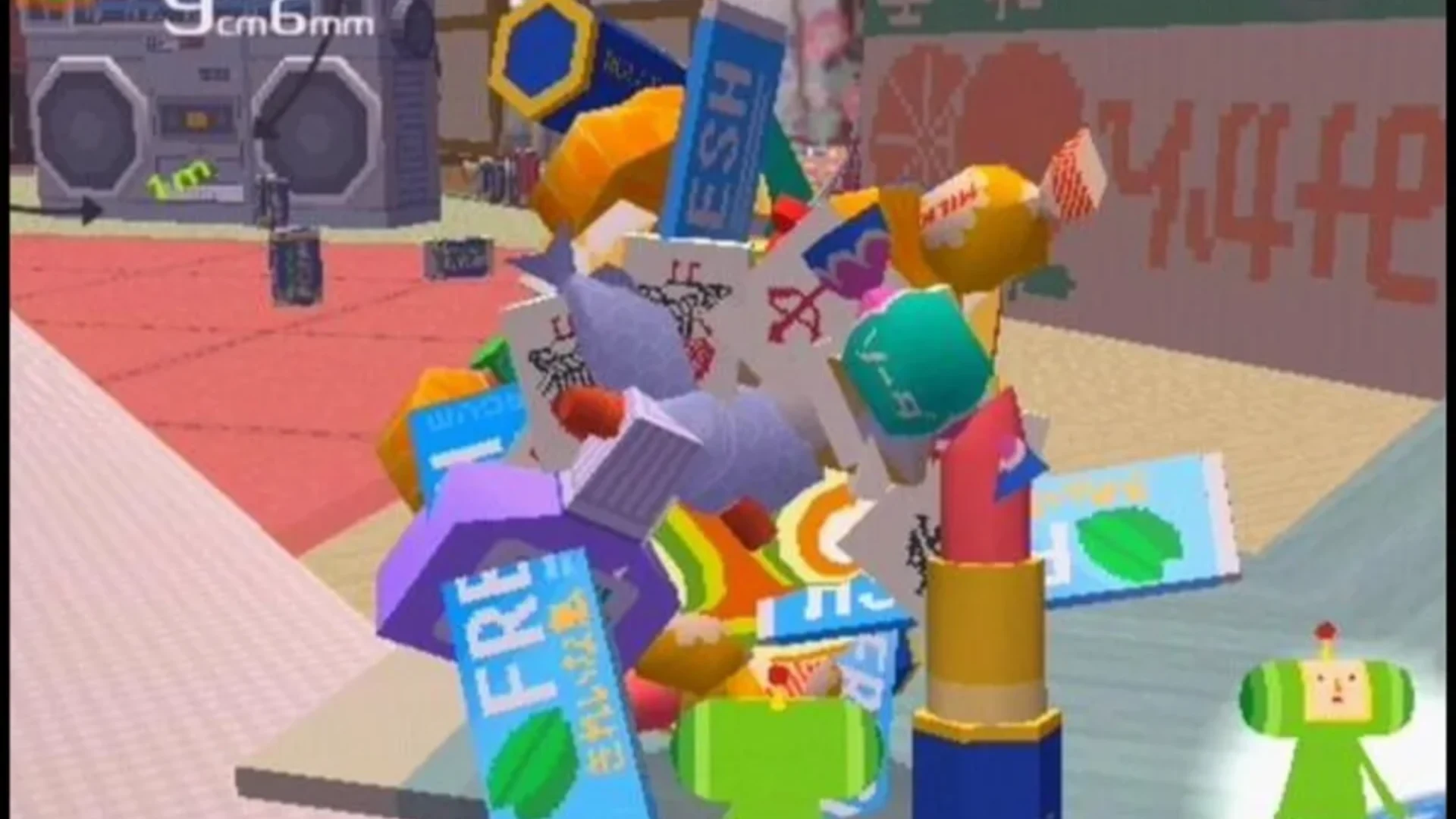 The Prince stands beside a giant katamari covered with colorful objects in Katamari Damacy.
