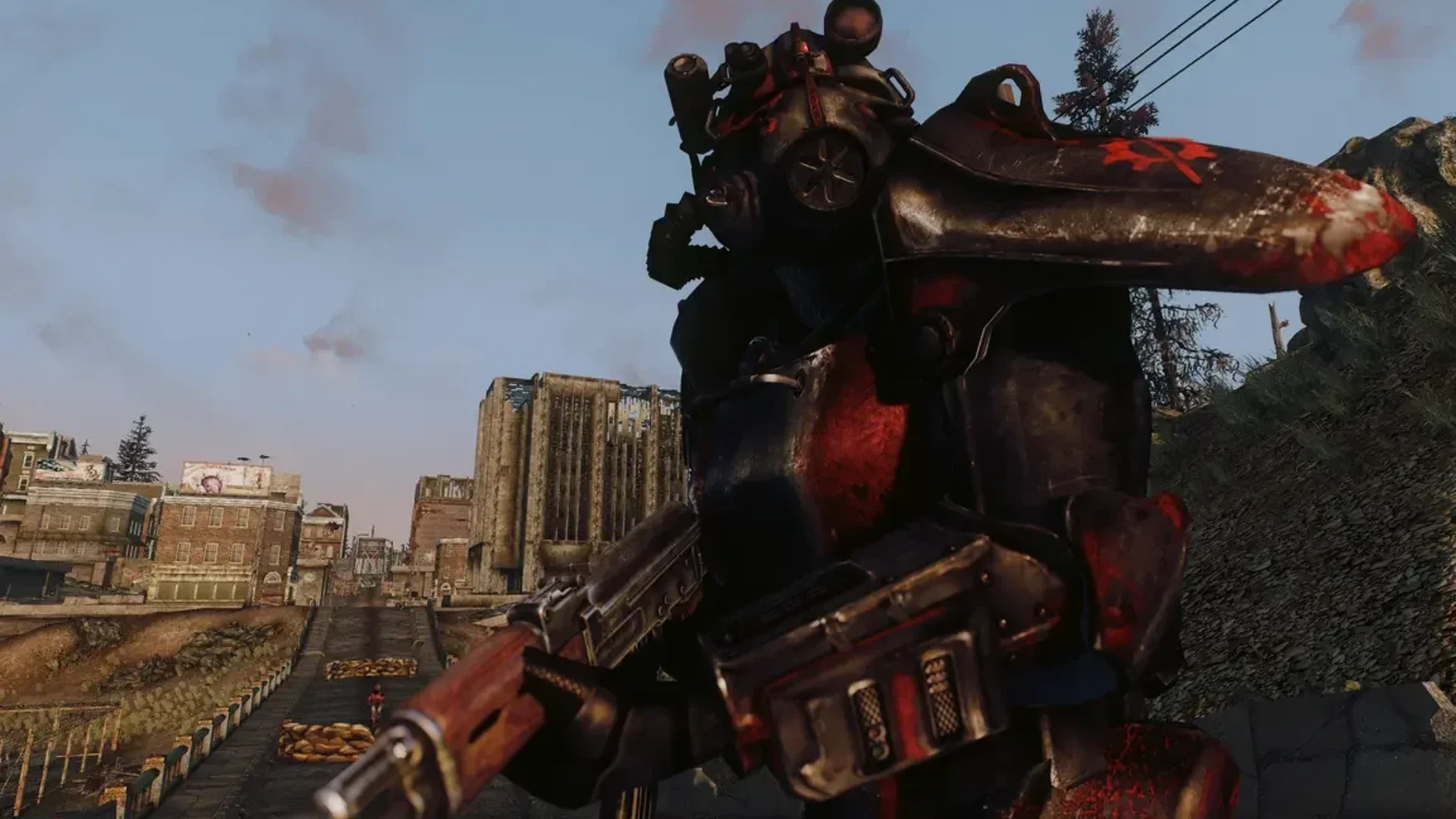 A Brotherhood of Steel soldier in power armor holds a rifle in the Capital Wasteland in Fallout 3.