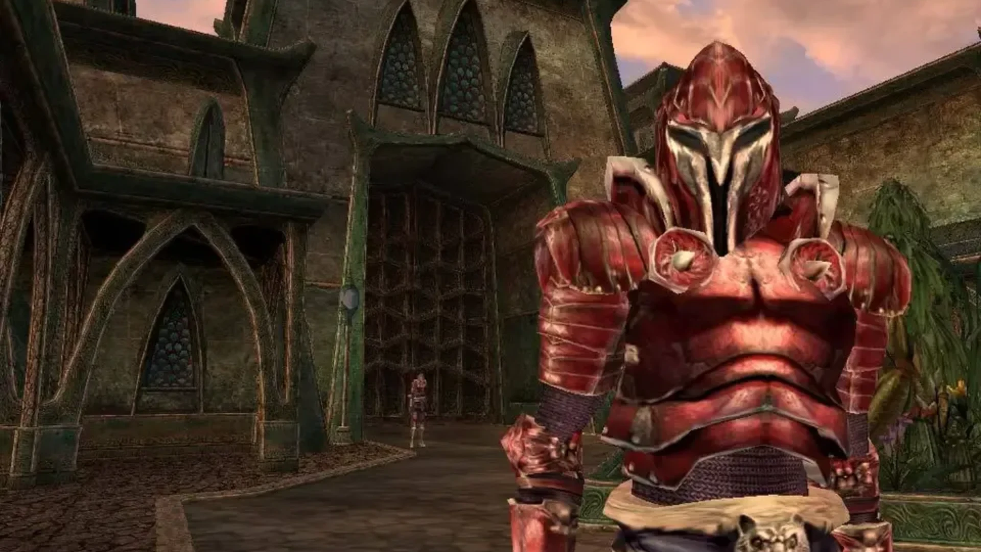 An Ordinator wearing red armor stands outside a building in Vivec City in The Elder Scrolls III: Morrowind.