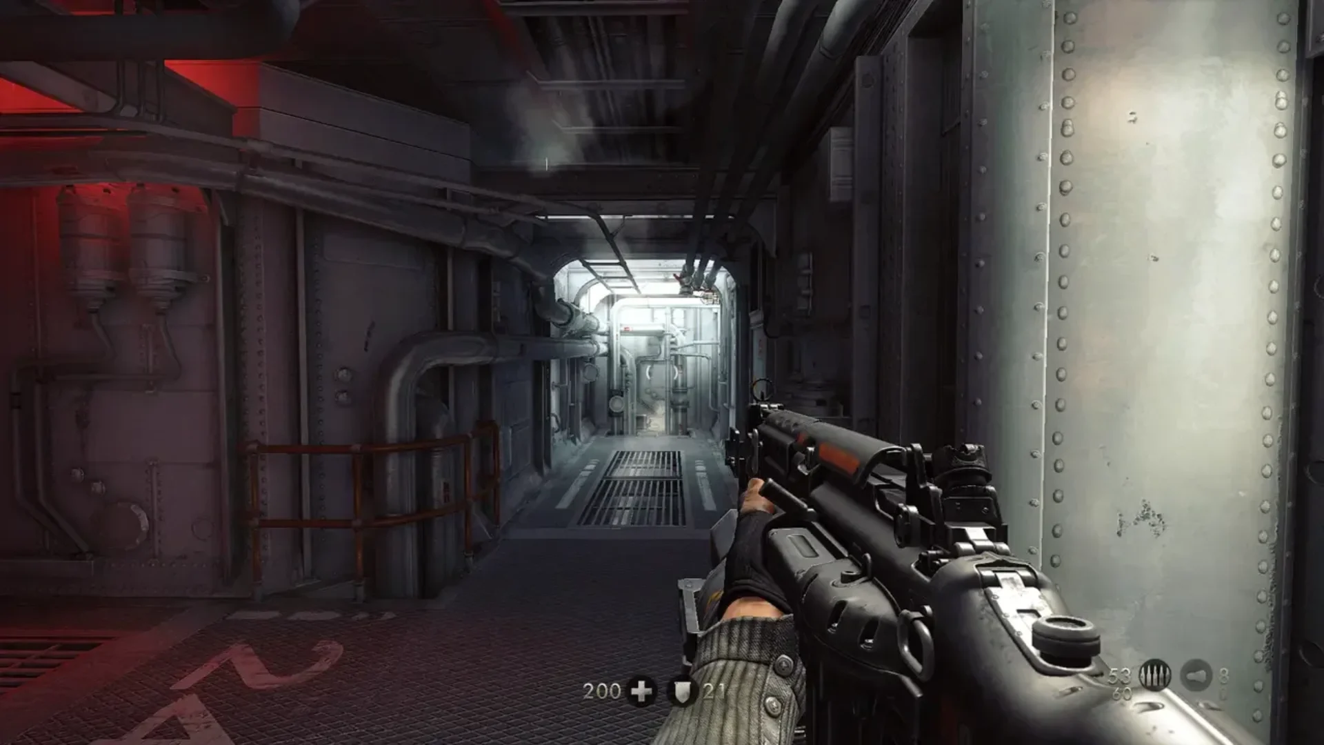 B.J. Blazkowicz aims a rifle through an industrial corridor in Wolfenstein: The New Order.