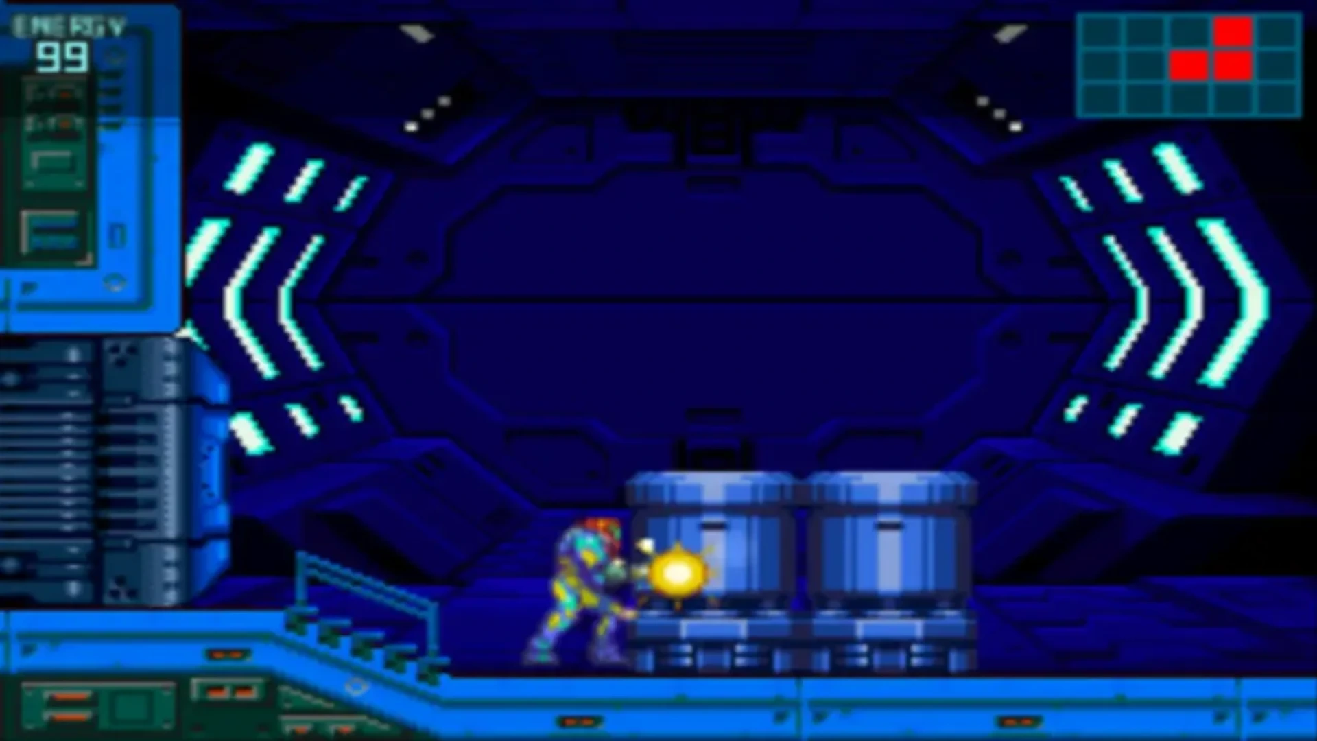 Samus fires her arm cannon at equipment inside a dark blue facility in Metroid Dread.