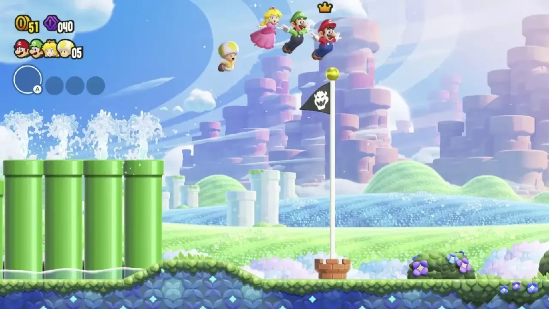 Super Mario Bros. Wonder gameplay shows Mario, Luigi, Peach and Toad leaping together through a colorful platforming course.