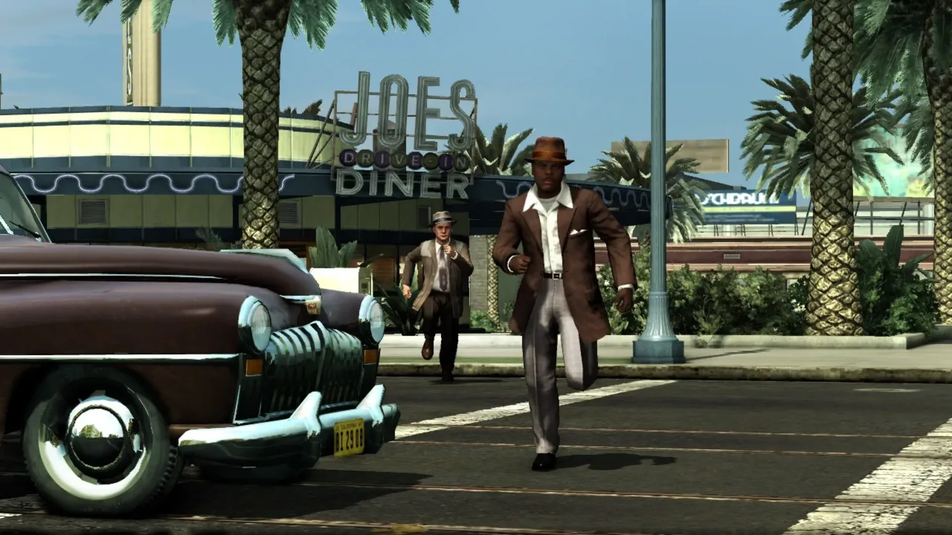 Detectives chase a suspect outside Joe's Diner in L.A. Noire