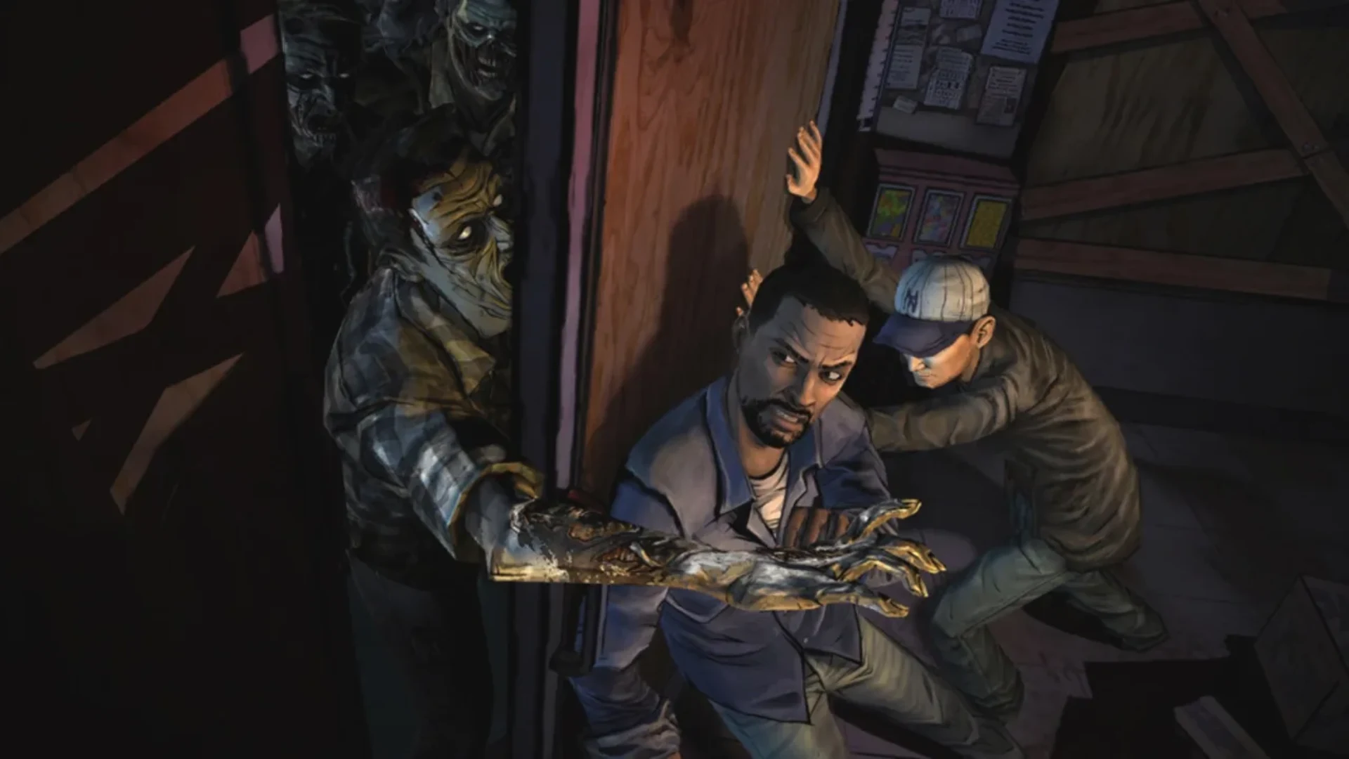 Lee Everett and Kenny struggle to hold a door shut as walkers reach through in The Walking Dead.