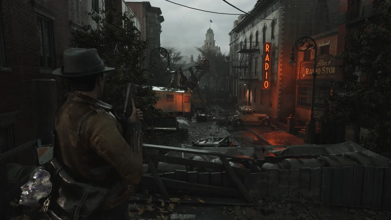 The Sinking City 2 protagonist overlooking a dark and rain-soaked street in Arkham.