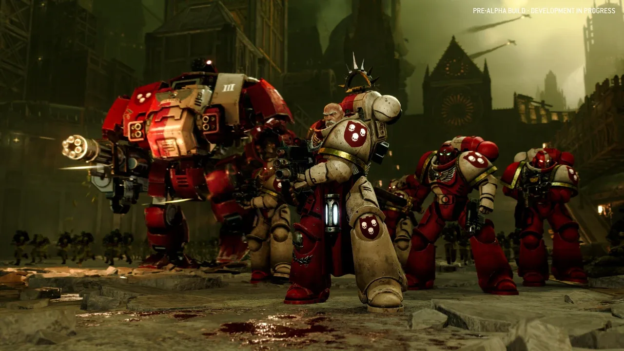 Total War: Warhammer 40,000 – A squad of heavily armoured Space Marines advances through a ruined gothic city alongside a red combat walker.