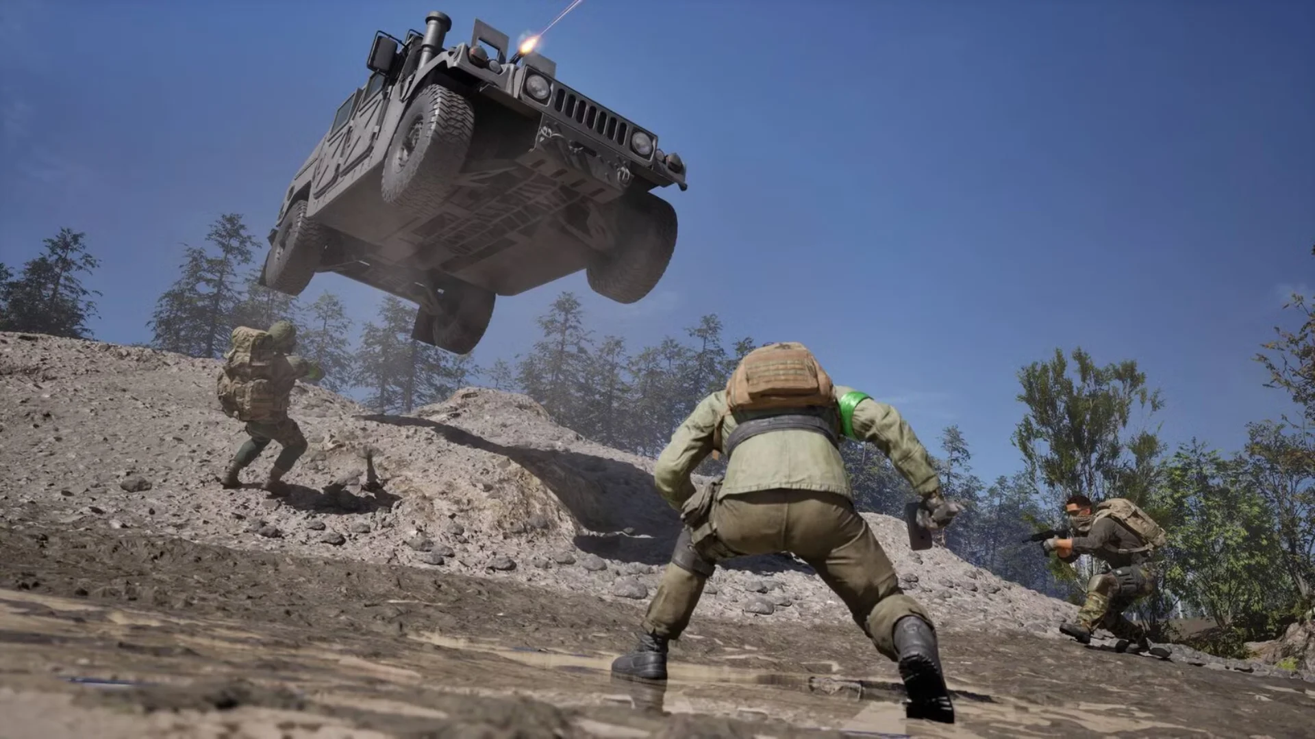 Soldiers take cover on rocky terrain as an armored vehicle launches overhead in WARDOGS.