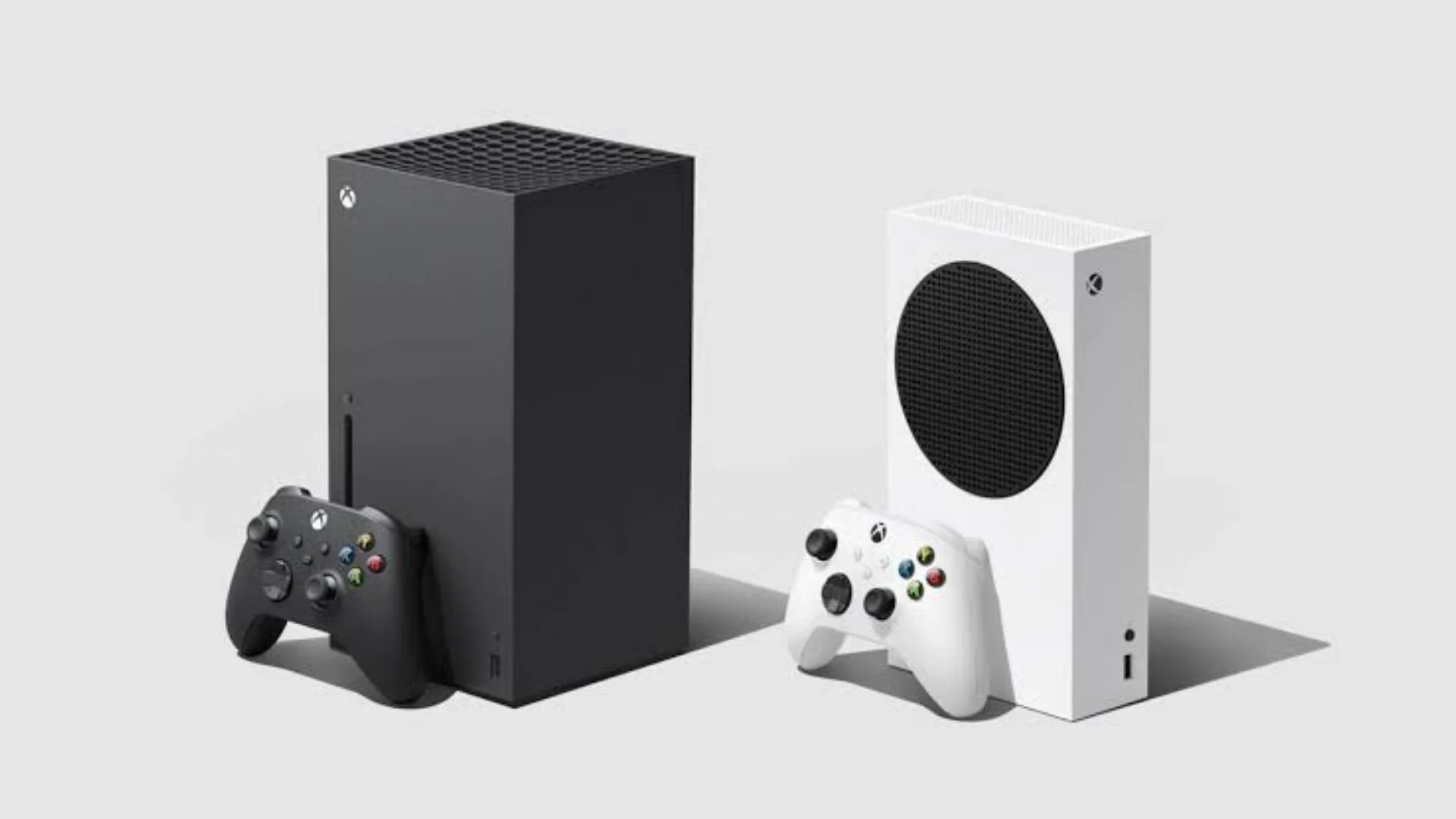 Xbox Series X and Series S consoles stand beside matching black and white wireless controllers.